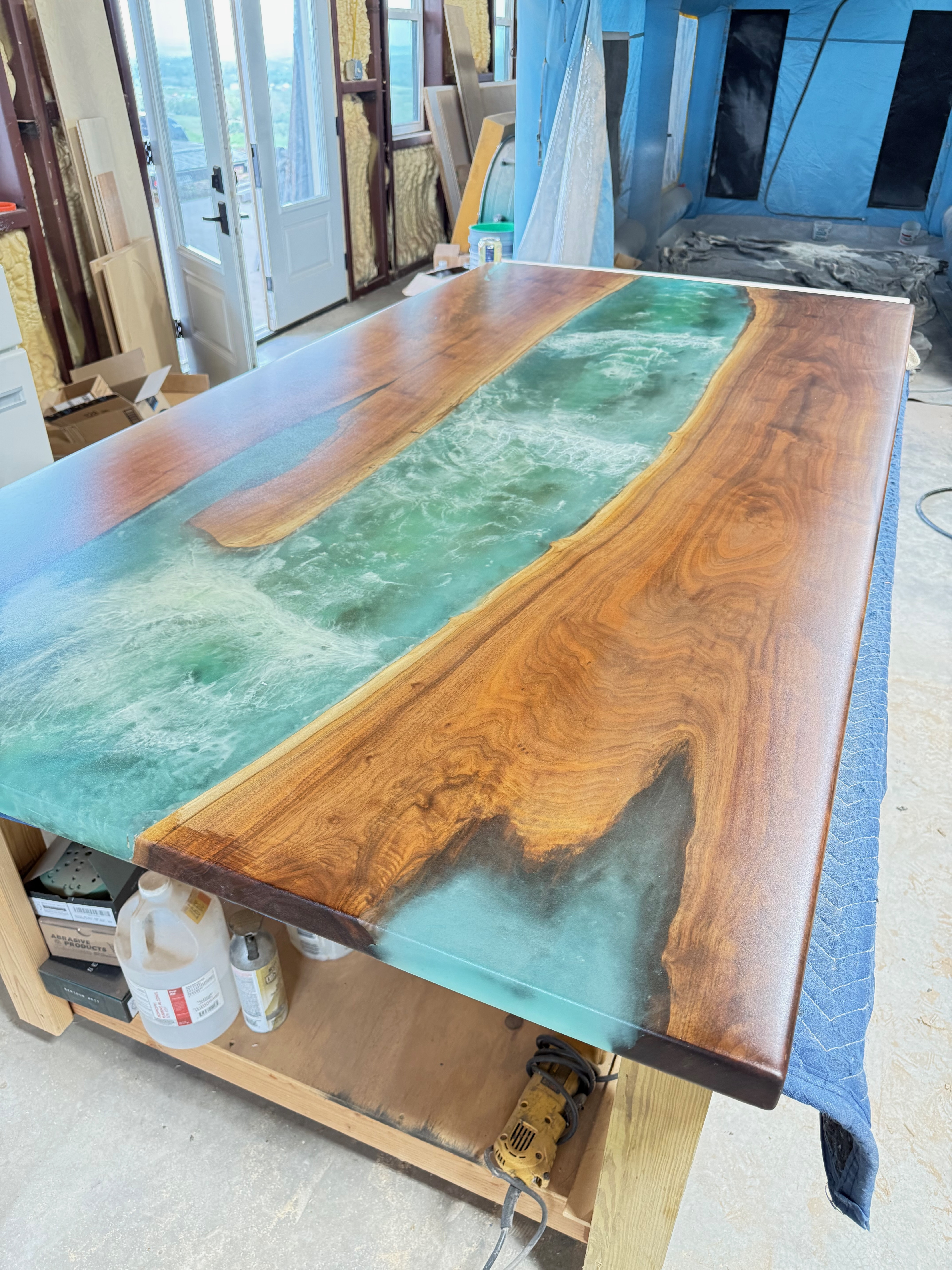 Walnut dining tabletop with buck inlay